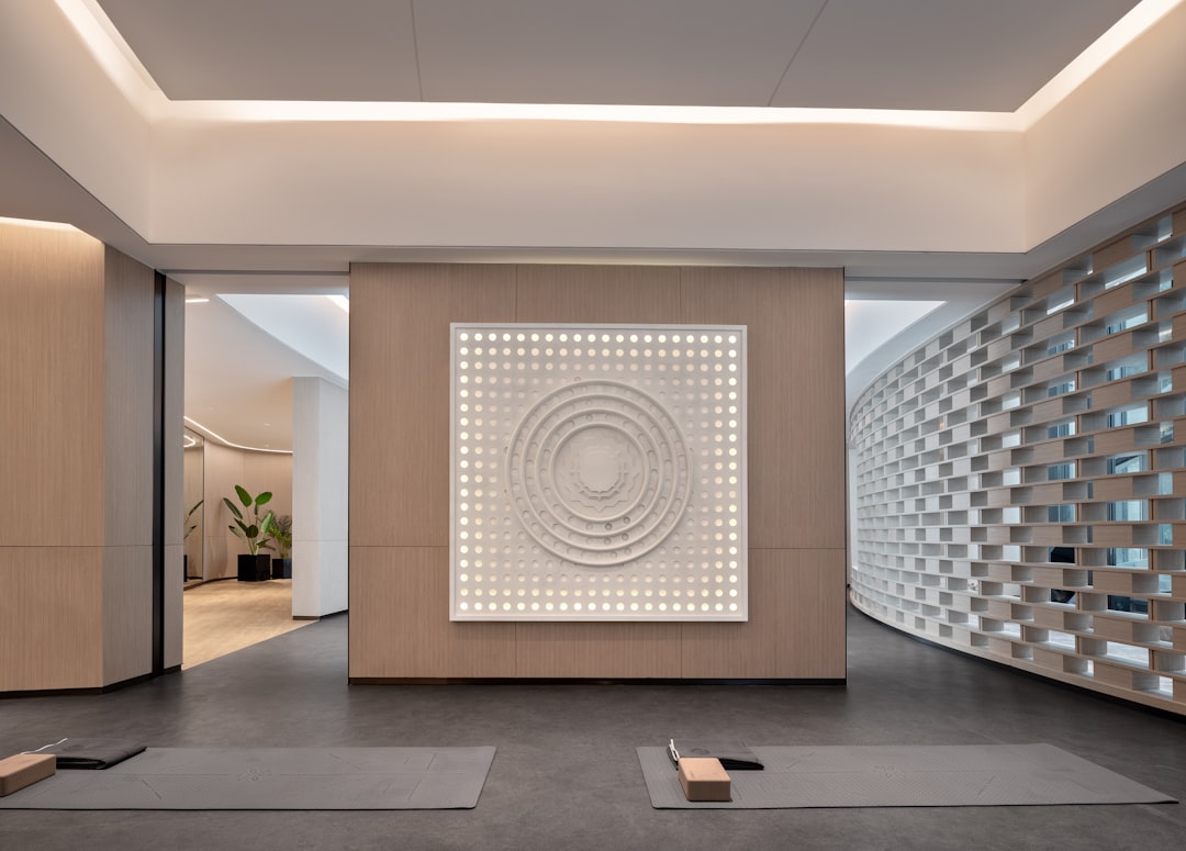 Modern yoga studio with minimalist decor and artwork.